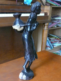hand-carved Ethiopian ebony statue of woman carrying jug